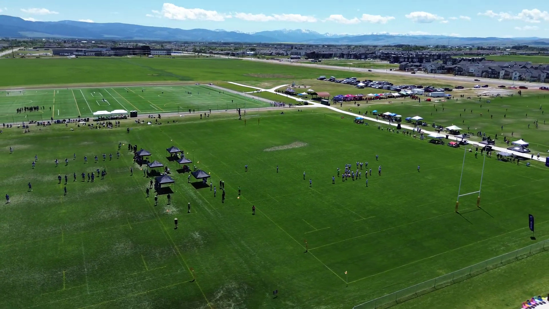 Aerial view of the rugby pitches in Bozeman, with the mountains on the horizon