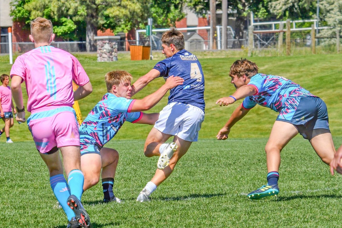 Players compete for the ball under the Big Sky